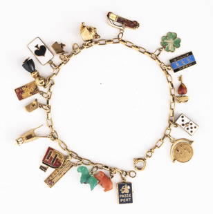 14K Gold Colored Stone Enamel Charm Bracelet: 14K Yellow Gold Colored Stone Enamel Petite Charm Bracelet with 18 various ornate charms. Bracelet measures 7.75"L x 0.68"W at widest section. Gold tested. Approx: 9.4 dwt. inclusive. Keywords: