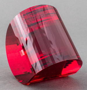 Modern Studio Art Glass Red Paperweight: Modern Studio Art Glass red glass paperweight or presse-papiers, of polyhedral d-shape with canted rest, inventory number "2755" to side, apparently unsigned. 4" H x 4" W x 3" D. Keywords: Baccarat