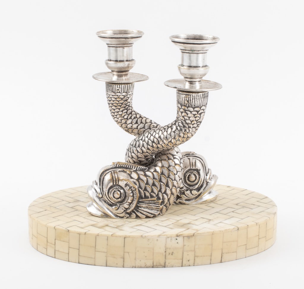 Anthony Redmile Attr. Dolphin Candelabra: Anthony Redmile (British, b. 1940) Attributed Candelabra, in the form of two silverplate dolphins entwined and surmounted by candlestick holders, atop an ovular tessellated bone base. 7.75" H x 9" W x