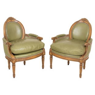 Louis XVI Style Green Leather Bergere Arm Chairs 2: Pair of Louis XVI Style Walnut and Green Leather Upholstered Arm Chairs, or bergeres en corbeille, each with floral carved crestrail above an oval upholstered back, the arms incurved and with drop in