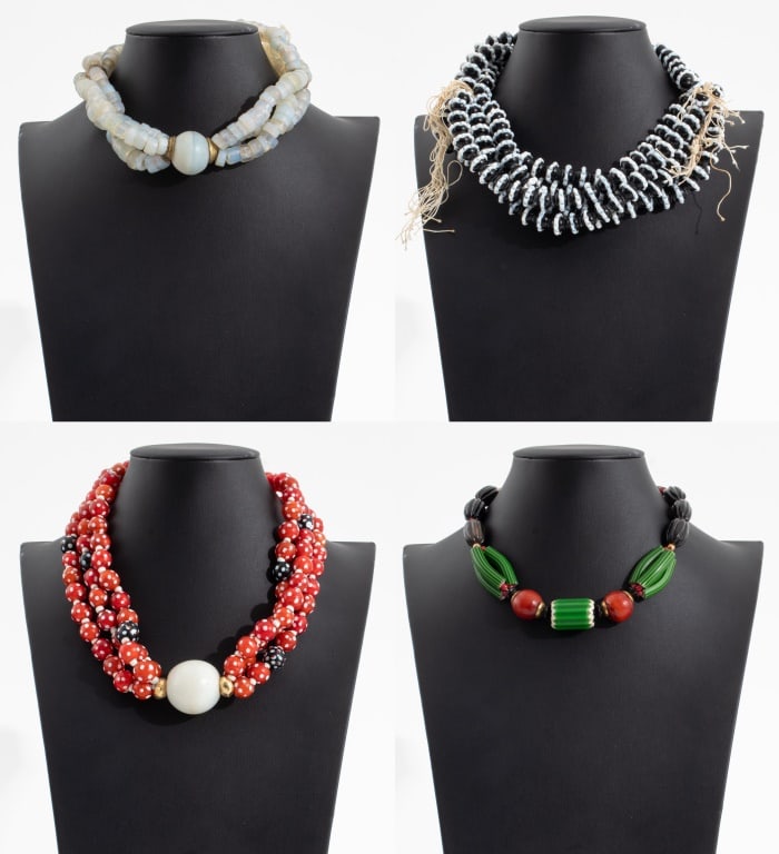 Antique Glass Trade Bead Strands, 4: Group of Four Antique Glass Trade Bead Strands, comprising: nine strands of dog tooth ruffle Venetian black and white beads, three strands of 19th century opalescent donut shaped beads with Cameroon b