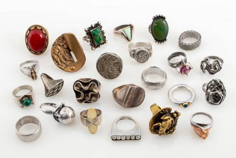 Modernist Silver & Metal Rings, 24: Group of 24 Modernist Mixed Metal rings, comprising: three Brutalist brass rings, one with frog atop a lily pad, and 21 sterling silver rings including: one with ancient Pre-Columbian greenstone carvi