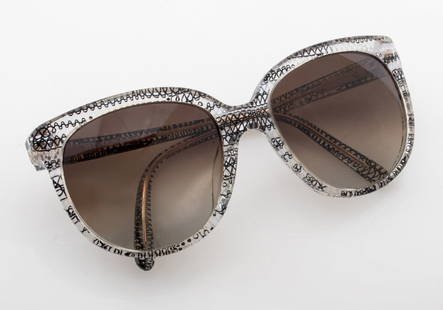 Missoni MI50S01 Clear Resin Sunglasses: Missoni MI50S01 Clear Resin Sunglasses, with black and white abstract design, marked "MI810S01 / 59 19 / 140" and "Missoni Made in Italy", with original Missoni case. 2.25" H x 5.50" W x 4.75" D.