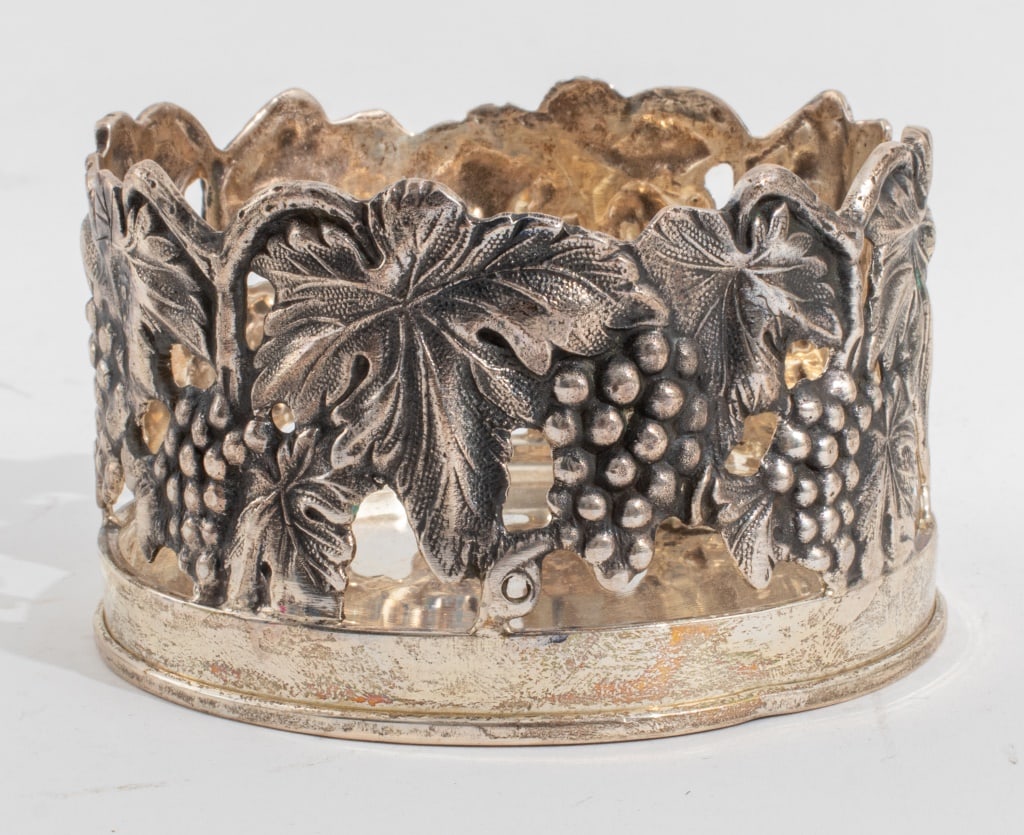 Indian George III Style Sterling Wine Coaster: Indian Sterling Silver Reticulated Wine Coaster in the Georgian taste, the sides cast and chased with naturalistic grapevines, struck "BARAN 925" to underside. Weight: 7.86 ozt.; 2.25" H x 4" Diameter