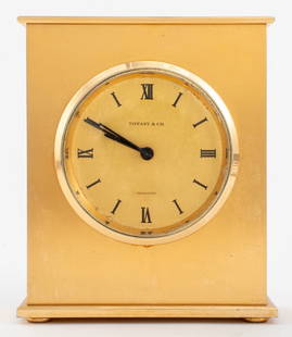 Tiffany & Co. Brass Transistor Desk Clock: Tiffany and Company Brass Transistor Desk Clock labeled "Tiffany & Co. / Transistor / Swiss", Junghans Quartz movement, and marked "Swiss #553" on bottom. 6.25" H x 5.50" W x 2.5" D. Provenance: Prope