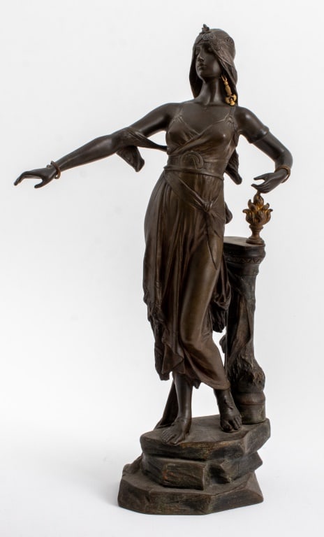 Edouard Drouot "Salome" Bronze Sculpture: Edouard Drouot (French, 1859-1945), "Salome", Patinated Bronze Sculpture, depicting the female figure standing atop a rocky base and wearing a diadem, snake form cuff bracelets, and gilt bronze earrin