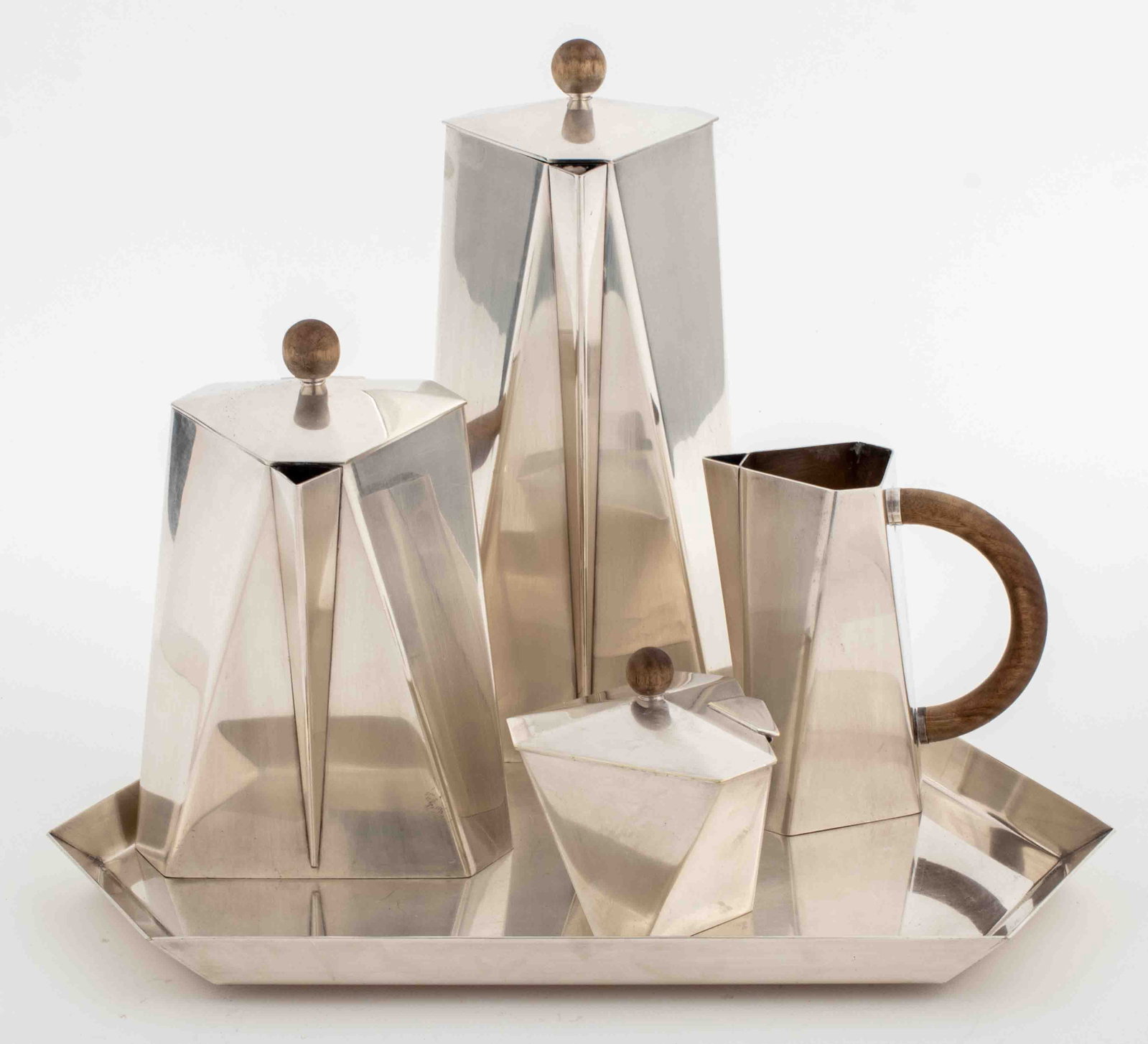Ken Benson Modern Silverplate Tea & Coffee Service: Ken Benson for St James Brazil (founded in Sao Paulo, 1976) Modern Minimalist Silverplate Tea and Coffee Service, of faceted geometric triangular form comprising five pieces: cream jug, coffee pot, an