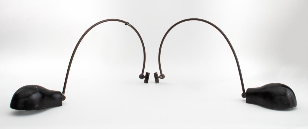 Mercer Kitchen Modern Arched Sconces, Pair: Mercer Kitchen arched sconces in black and brown enameled steel inspired by Jean Prouve (French, 1901-1984) 14" H x 24" L x 4" W Provenance: The Mercer Kitchen, Mercer Hotel, New York. Note: The Merce