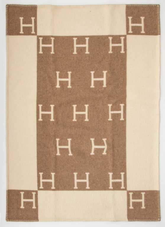 Hermes Wool Blanket: Hermes Wool Blanket, with "H" logo design in beige and camel tones. 62" L x 52" W. Provenance: From a Central Park South estate. Keywords: Designer, Luxury, Throw