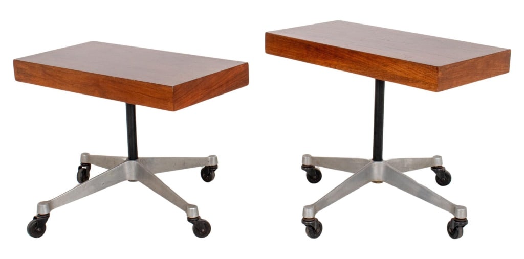 Herman Miller Walnut Rolling End Tables, 2: Pair of Herman Miller Walnut Rolling End Tables, customized tops on Herman Miller bases. Taller: 20" H x 24" W x 18" D. Provenance: From a 240 East 15th Street estate. Keywords: Furniture, Mid-Century