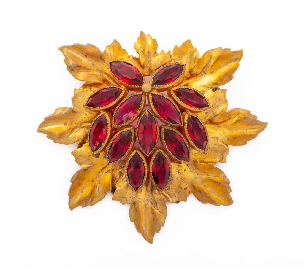 Joseff of Hollywood Gold-Tone Leaf Form Brooch: Joseff of Hollywood Gold-Tone Leaf Form Brooch, with faceted red rhinestones, marked "Joseff Hollywood" to verso. 3" L x 3.25" W. Provenance: From a New York City Collection. Keywords: Costume, Jewelr