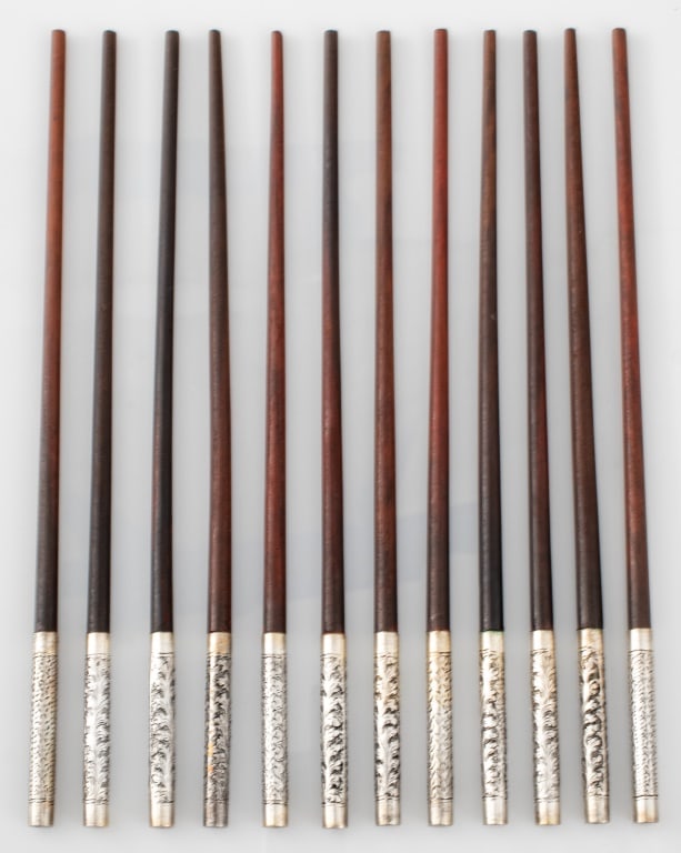 Carved Wood and Silver Chopsticks, 12: Set of 12 Carved Wood and Silver Chopsticks with incised floral decoration, each marked to top. Each 9.50" L. Provenance: From a New York City Collection. Keywords: Asian, Utensils, Flatware, Tablewar