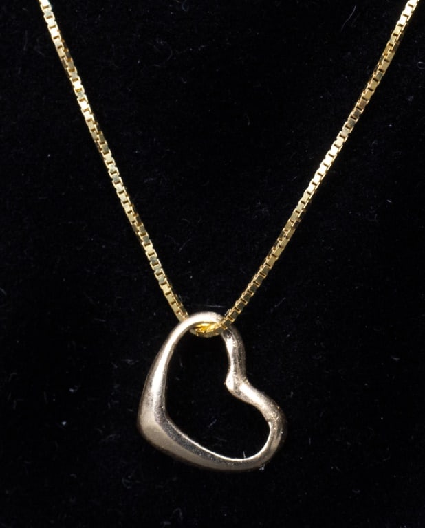 14K Yellow Gold Open Heart Pendant on 10K Chain: 14K Yellow Gold Open Heart Pendant on 10K Mini-Box Chain Necklace with spring clasp, marked: "FZN -10K / INDONESIA / 14k". Heart pendant: 0.37"L x 0.31:W. Chain: 22.0"L x 0.03"W. Approx: 1.0 dwt. Prov