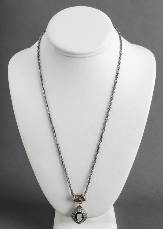Italian Silver & Marcasite Cameo Pendant Necklace: Italian Antiqued Silver and Marcasite, Mother-or-Pearl, and Onyx Cameo Pendant Necklace, marked: "925A / 925 / ITALY / MADE IN ITALY". Pendant measures 1.5" L x 0.75" W x 0.5" H. Rope chain measures 2