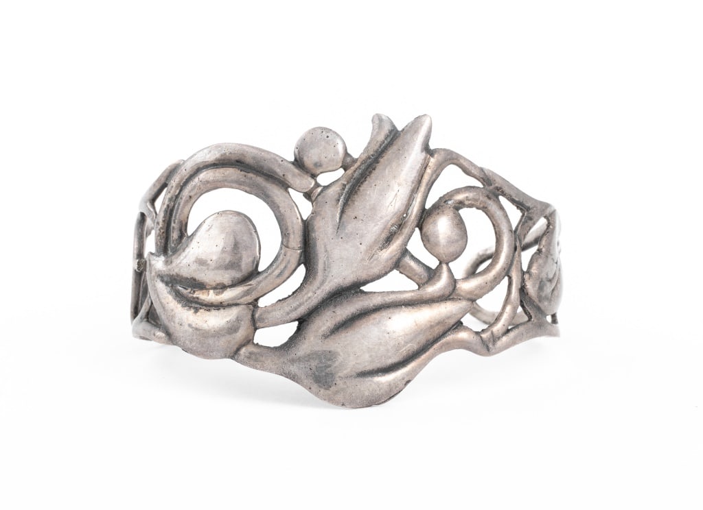 Danish Sterling Silver Floriform Bangle Bracelet: Danish Sterling Silver Floriform Bangle Bracelet, marked: "STERLING". 1.56" W at widest section with 6.5" L inner circumference. Approx: 0.77 ozt. Provenance: From a New York City Collection. Keywords
