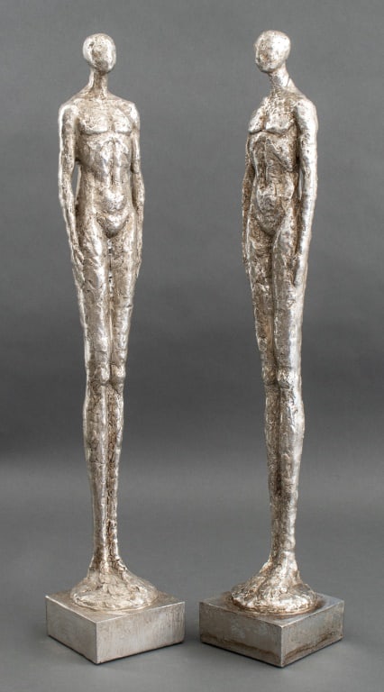 After Giacometti Silvered Ceramic Sculptures, Pair: Pair of After Alberto Giacometti (Swiss,1901-1966) Silvered Ceramic Sculptures, nude figures, affixed to base, apparently unsigned. 23.25" H x 4" W x 4" D. Provenance: From a Central Park South estate