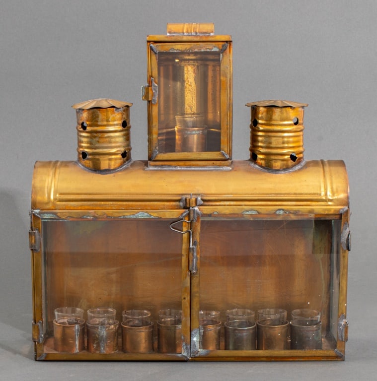 Brass Oil Lamp Menorah, 19th C.: Brass Oil Lamp Menorah, circa late nineteenth century, with glass cups and two chimneys. 14" H x 13.25" W x 4" D. Provenance: From a 25 E. 83rd Street Estate. Keywords: Antique, Judaica, Jewish, Hanuk