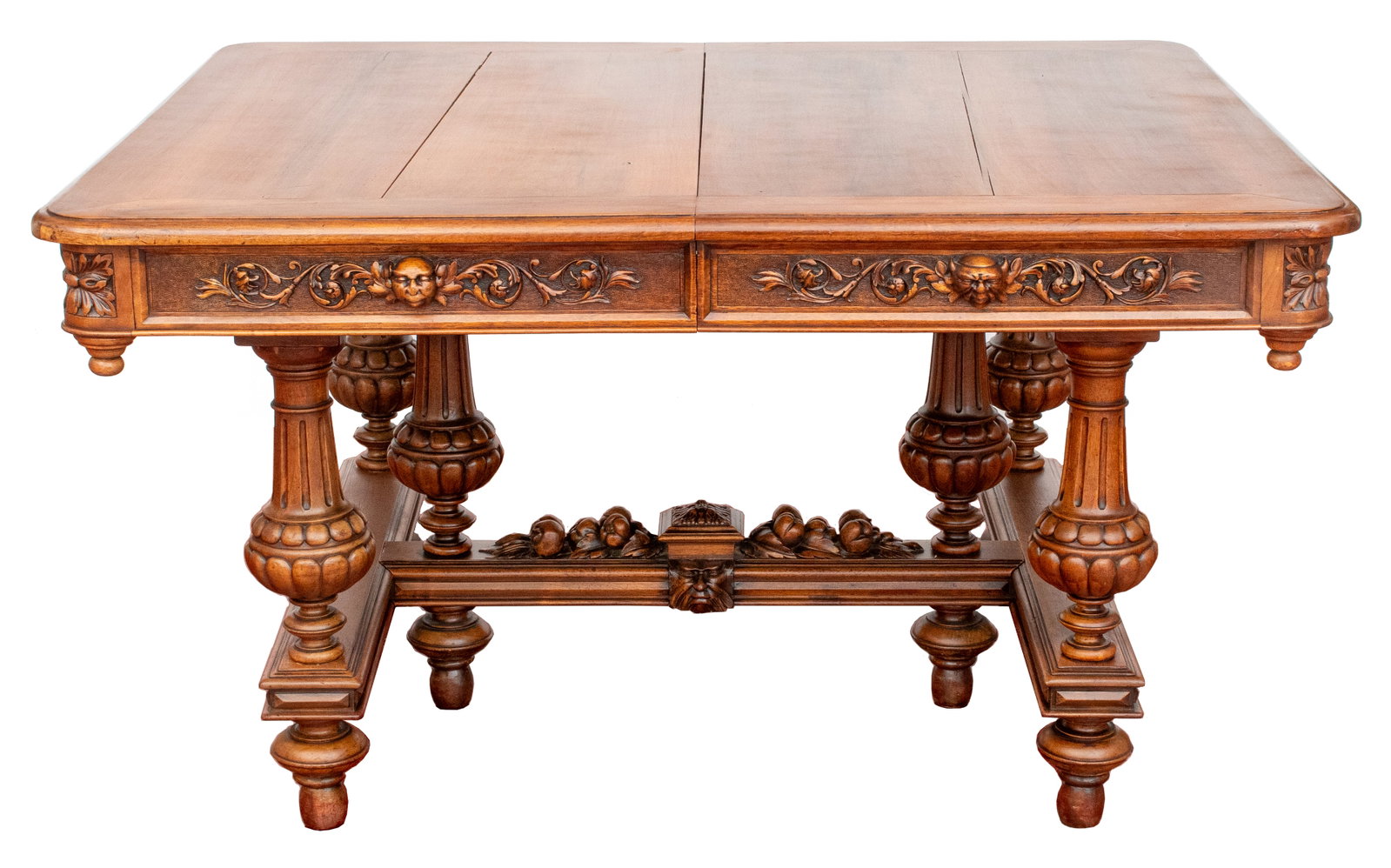 Renaissance Revival Walnut Dining Table, 19th C.: Renaissance Revival Walnut Extending Dining Table, 19th century, with five leaves, figural and foliate carved frieze motifm, and on six turned feet with stretchers. 30.5" H x 54.25" W; extended: 143.5
