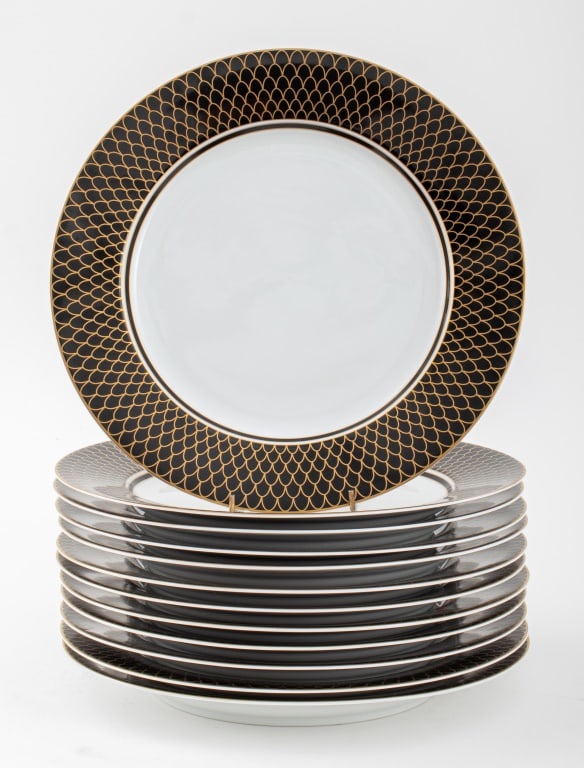 Lynn Chase "Midnight Collection" Chargers, 12: Set of Twelve Lynn Chase "Midnight Collection" Porcelain Chargers, 2000, each marked to underside and decorated with 24K yellow gold. 12" Diameter. Provenance: From a 188 E 78th Street Estate. Keyword