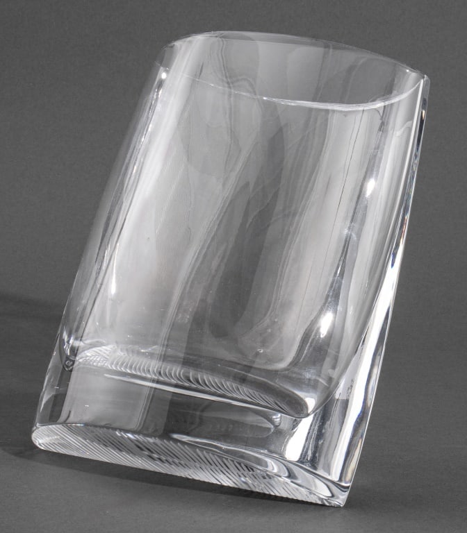 Baccarat Crystal Leaning Vase: Baccarat Crystal Leaning Vase, bottom with etched parallel lines, etched "Baccarat" and mark. 8" H x 7" W x 5.5" D. Provenance: From a Central Park West Collection. Keywords: Designer, Art Glass, Geom