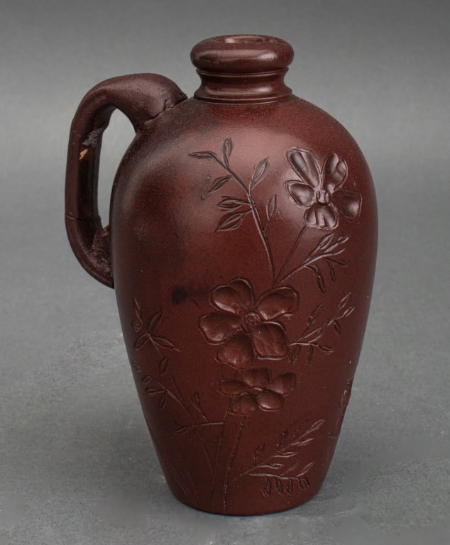 Harriet Wenderoth for Rookwood Perfume Jug, 1883: Harriet Wenderoth (American, XIX) for Rookwood Perfume Jug, 1883, glazed red earthenware, with impressed and carved floral design, stamped "Rookwood 1883 / 61" with kiln stamp and signed "H W" to unde