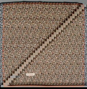 Yves Saint Laurent Paisley Silk Scarf: Yves Saint Laurent Paisley Silk Scarf, brown stylized paisley print on black ground, marked "Yves Saint Laurent" lower right. 27" L x 27" W. Provenance: From a 575 Park Avenue Estate. Keywords: