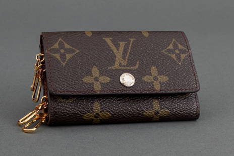 Louis Vuitton Monogram 6 Key Holder Wallet: Louis Vuitton Monogram Canvas Six Key Holder Wallet, marked "(R) / LOUIS VUITTON / PARIS / made in France" inside, with button closure, gold-tone metal hardware, and dust bag. Closed: 2.5" H x 4" W.