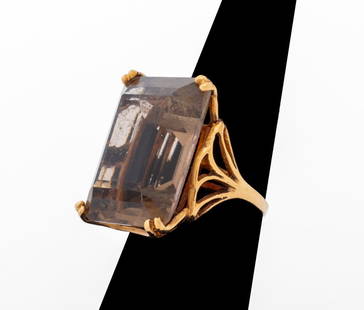 14K Yellow Gold Smoky Quartz Ring: 14K Yellow Gold Ring, featuring one rectangular step cut smoky quartz weighing approx. 25.00 carats. Gold tested. Measuring approx. US size 6, 7/8" x 5/8", 6.0 dwt. Provenance: From a 230 Central