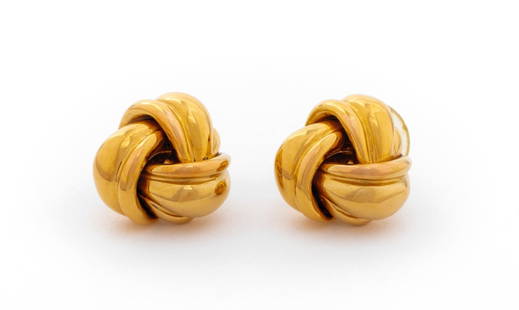 14K Yellow Gold Knot Earrings: 14K Yellow Gold Knot Earrings, worn through pierced earlobes with post and friction backs, marked: "14K OC". Measuring approx. 1/2" across widest point, 2.5 dwt. Provenance: From a New York City