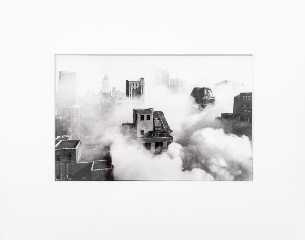 Jon Levy Fire in Garment District, NYC Photograph: Jon Levy (British, b. 1967), Fire in Garment District, New York City, Black and White Photograph, label to verso. Image: 6" H x 9" W; mat: 11" H x 14" W. Provenance: From the 50 East 89th Street estat