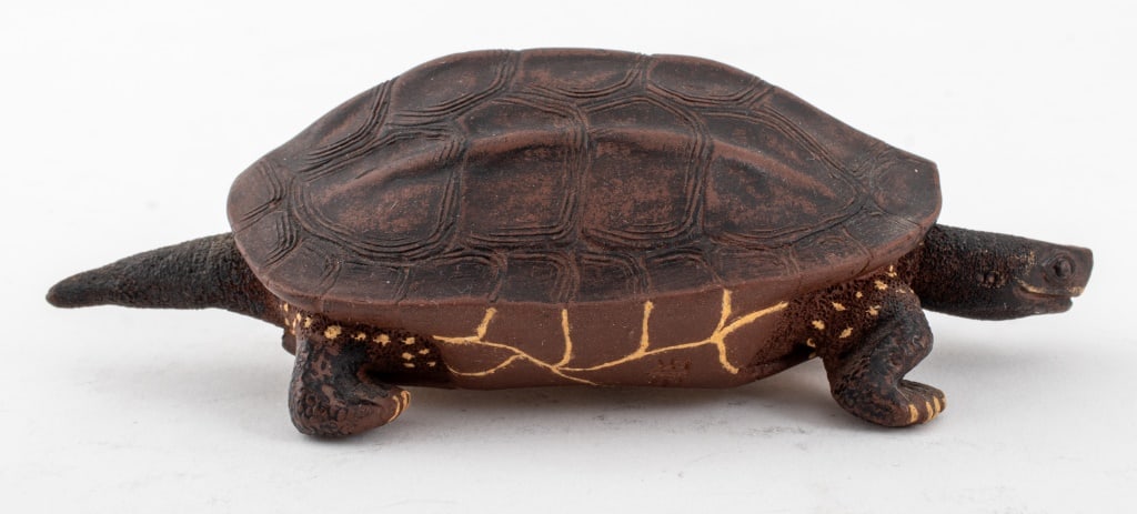 Japanese Pond Turtle Pottery Sculpture: Japanese Pottery Sculpture of a Pond Turtle, realistic in appearance and in scale, with articulating neck, marked to underside. 2" H x 6" L x 2.5" W. Provenance: From a New York City Collection. Keywo