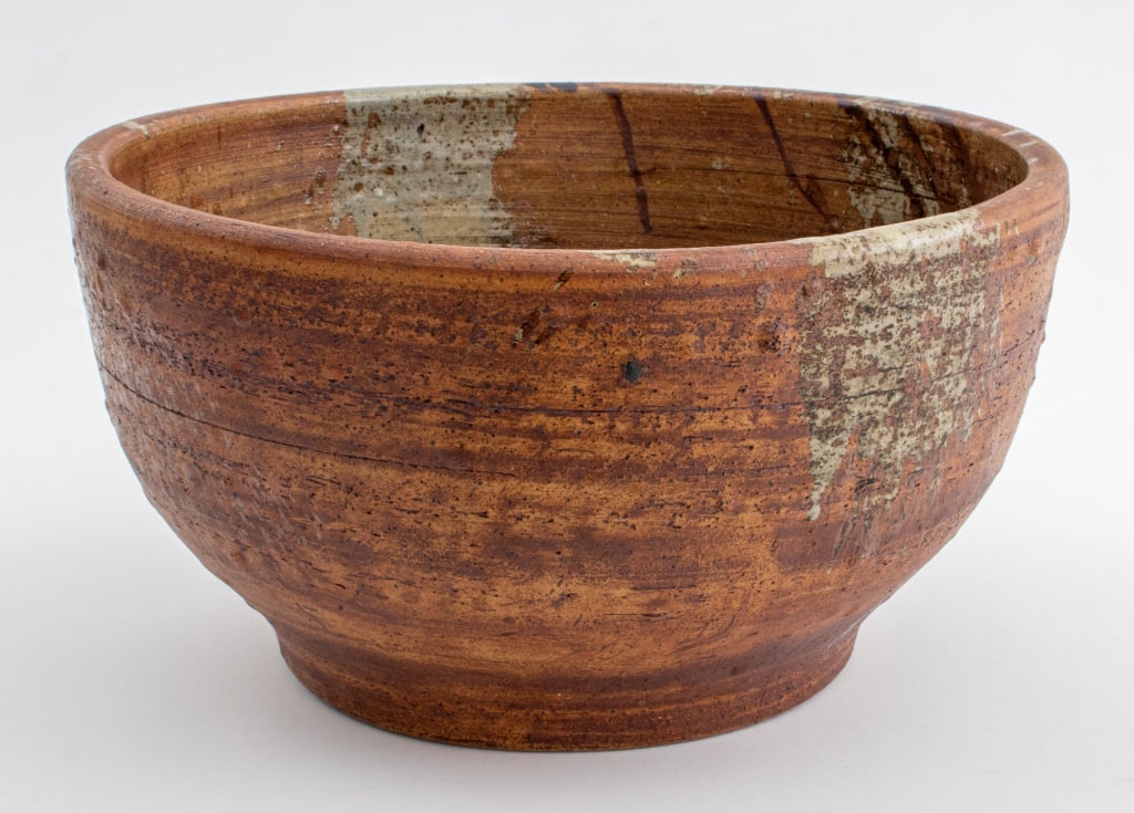 American Studio Art Pottery Bowl: American Studio Art Pottery Bowl, with dark brown and pale grey glazes over red ware, the underside with impressed mark "CW" for an unknown maker. 7" H x 12" Diameter. Provenance: From the Estate of f