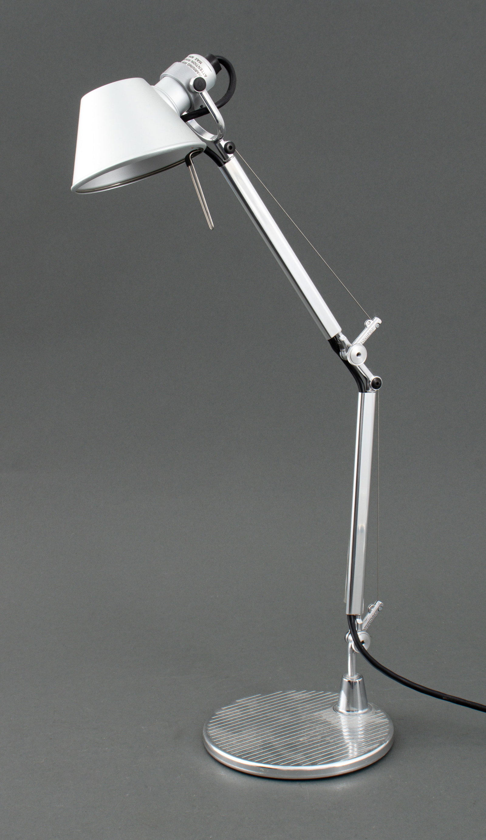Artemide "Tolomeo Micro" Aluminum Desk Lamp: M. de Lucchi and G. Fassina for Artemide "Tolomeo Micro' Flexible Aluminum Desk Lamp, original label on arm and base, circa 1980. Fully extended: 25" H x 7" Diameter. Provenance: From a New York City