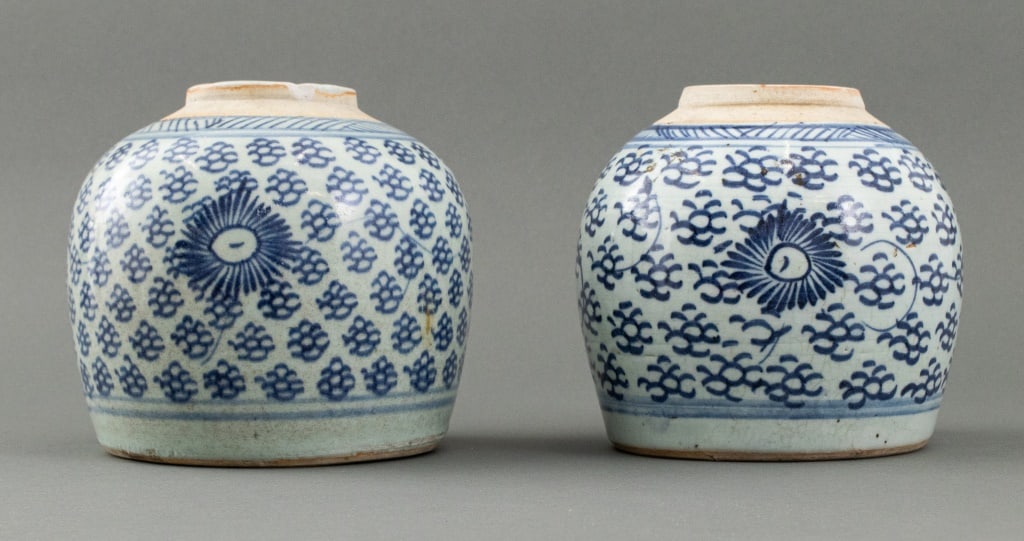 Chinese Blue and White Porcelain Ginger Jars, 2: Associated Pair of Chinese Blue and White Porcelain Ginger Jars, red three character stamp marks to undersides, hand-painted with sunburst designs. 6.5" H x 6.25" Diameter. Provenance: From an Upper W