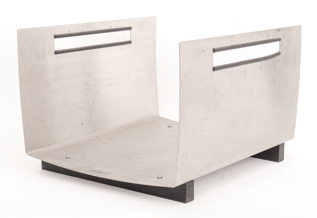 Blomus Stainless Steel "Chimo" Log Holder: Blomus Stainless Steel "Chimo" Log Holder, rectangular shape, on black metal legs, with carrying holes, labeled 'Blomus" to front face. 12" H x 17.75" W x 15.5" D. Provenance: From a New York City Col