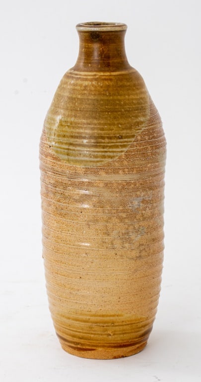 American Studio Art Pottery Vase: American Studio Art Pottery Vase, signed "C. Rudarfy(?)", of tall form and with ridges, the whole glazed in ocher over redware. 9.25" H x 3.5" Diameter. Provenance: Property from the estate of the art