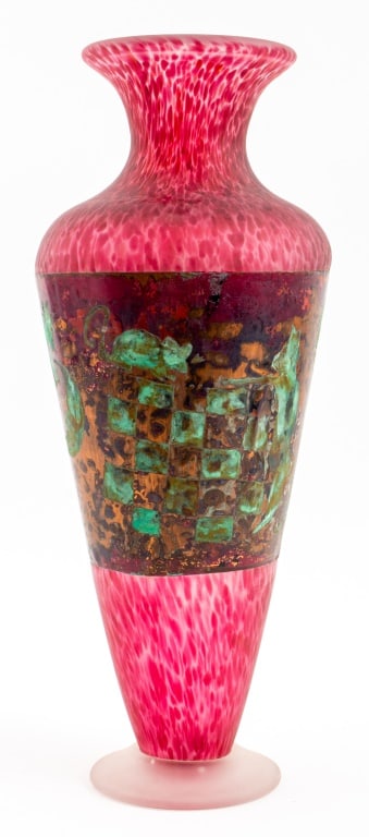 Signed Copper Mounted Studio Art Glass Vase: Modern Copper Mounted Studio Art Glass Vase in mottled red frosted glass mounted with a verdigris copper panel depicting a Surrealist scene with animals, figures, and checkerboard motif, raised on a r