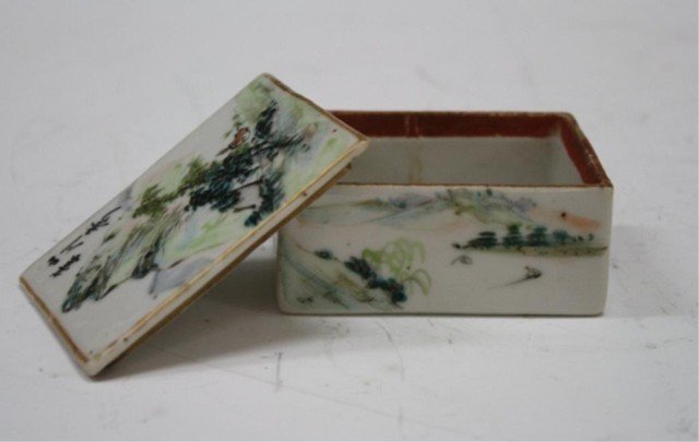 Chinese Small White Porcelain Box w Mountain & Lid: Small white porcelain box decorated on top with a figure seated at the foot of a mountain surrounded by a gilt border and on the sides with flowers, trees and calligraphy, China; marked. Dimensions: 3