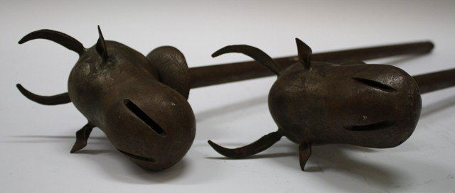 Pair of Bronze Indo Persian Bull Head Scepters: Lot of two antique Indo Persian scepters or maces with figurative bull animal heads, bronze; unmarked. Dimensions: 26"L x 3-1/2"W (horn to horn) x 6"D (depth of head).