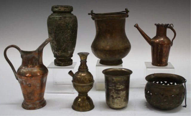 Lot of 7 Antique Syrian Islamic Metal Vessels: Lot of seven Islamic metal vessels including an incense burner, pitchers, vase, etc., Syria; unmarked. Dimensions: varying sizes.