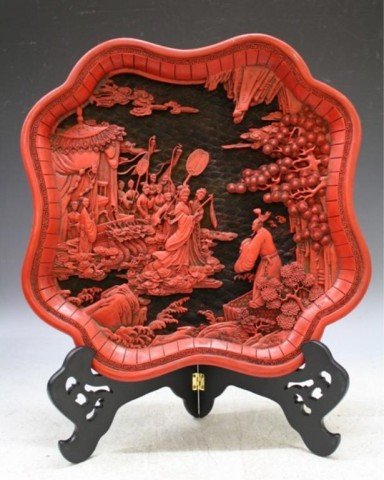 Chinese Large Cinnabar Carved Plaque w/ Figures: Large cinnabar carved plaque with figures and dragons in landscape design, China; unmarked. Dimensions: 15-1/4" L x 15-1/4" W at longest and widest points