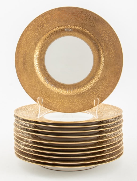Hutschenreuther Gold-Encrusted Dinner Plates, 11: Set of 11 Hutschenreuther Gold-Encrusted Porcelain Dinner Plates, the rims with raised gold embossed Art Nouveau scrolling floral designs, each with "Hutschenreuther / Selb / LHS / BAVARIA" marks for