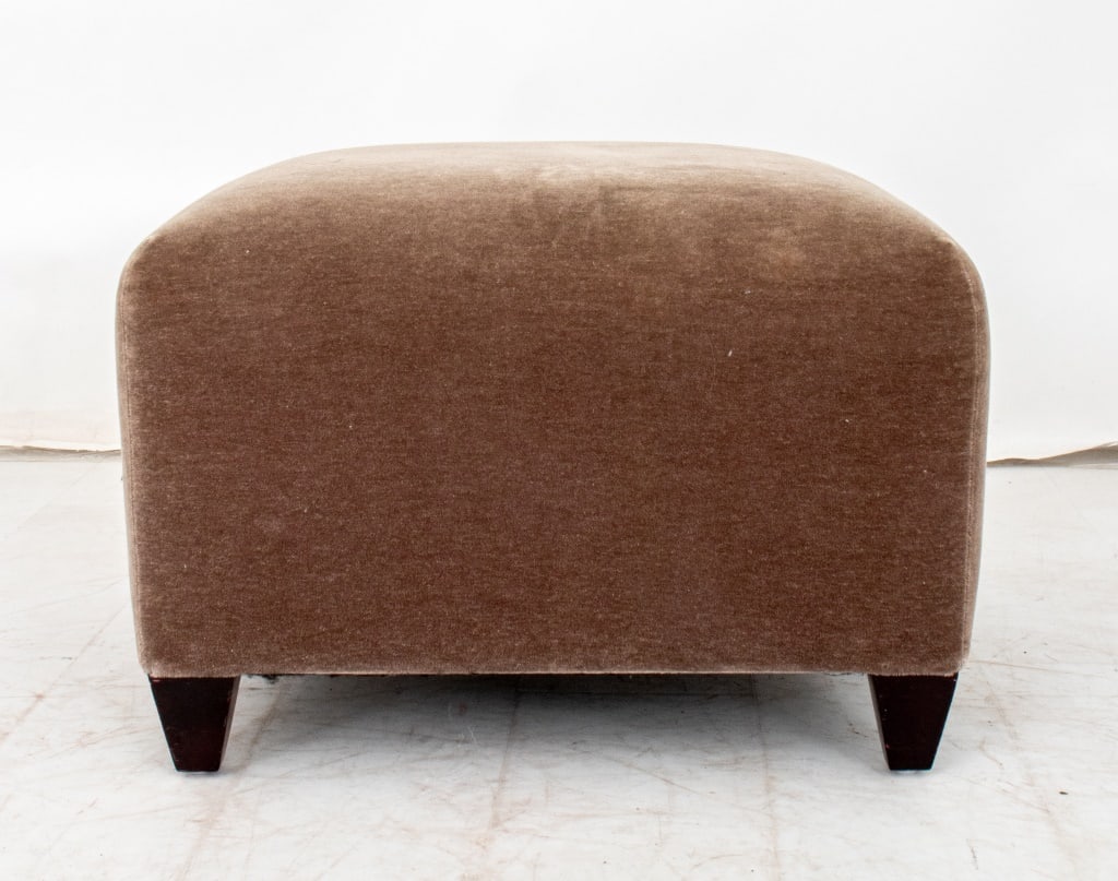 John Hutton for Donghia Ultrasuede Ottoman: John Hutton for Donghia Ultrasuede Ottoman, cloth label "Donghia A John Hutton Design" to underside. 16.25" H x 22.5" W x 23" D. Provenance: From a Fifth Avenue Collection. Keywords: Furniture, Seatin
