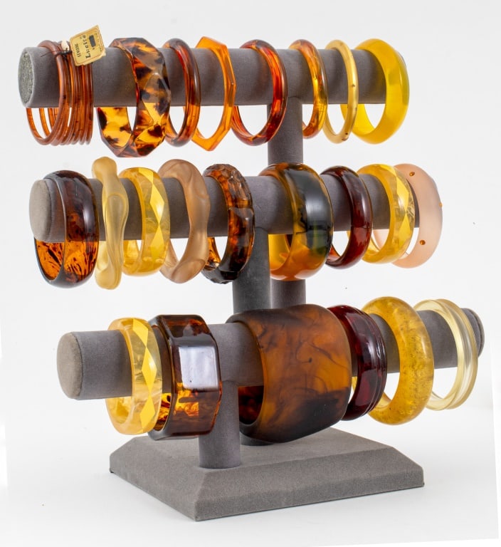 Collection of Resin and Lucite Bracelets, 60: Collection of Sixty Resin and Lucite Bracelets, various colors and sizes, apparently unmarked. Largest: 2.5" H x 3.75" Diameter. Provenance: From a New York City Collection. Keywords: Fashion, Accesso