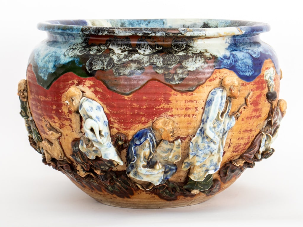 Chinese Shiwan Flambe Glazed Pottery Jardiniere: Chinese Shiwan Flambe Glazed Pottery Jardiniere, marked near base, with scholar figures in high relief. 12.25" H x 18" Diameter. Provenance: From an Upper West Side estate located at the Ansonia. Keyw