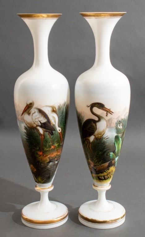 French Hand-Painted Porcelain Vases, Pair: Pair of French Hand-Painted Porcelain Vases, one with grey heron with fish in mouth, the other with two white herons catching frogs, apparently unmarked. 17.75" H x 5" Diameter. Provenance: From a Cen