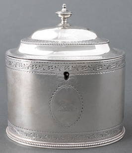 George III Sterling Silver Tea Caddy, 1784: George III Sterling Silver Tea Caddy, struck with marks for Hester Bateman, London, 1784, with urn finial and bear claw crest to center. 5.75" H x 5" W x 3.5" D; weight: 10.96 ozt. Provenance: From a
