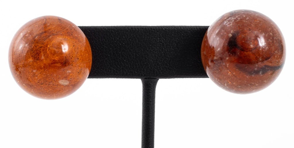 14K Yellow Gold Baltic Amber Stud Earrings: Pair of 14K Yellow Gold Cognac Color Baltic Amber Stud Earrings, set with two 22 mm round cabochon-cut amber. Earrings measure: 0.87" L x 0.87" W x 1.0" H. Approx: 5.0 dwt. inclusive. Provenance: From