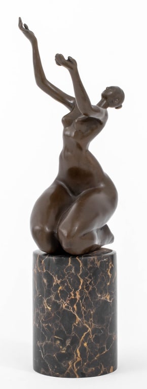 Juno Kneeling Nude Woman Bronze Sculpture: Juno (XX) Kneeling Nude Woman with Arms Raised Patinated Bronze Sculpture, mounted on a black marble base. Overall: 12.75" H x 5" W x 3.75" D. Provenance: From a New York City Collection. Keywords: St