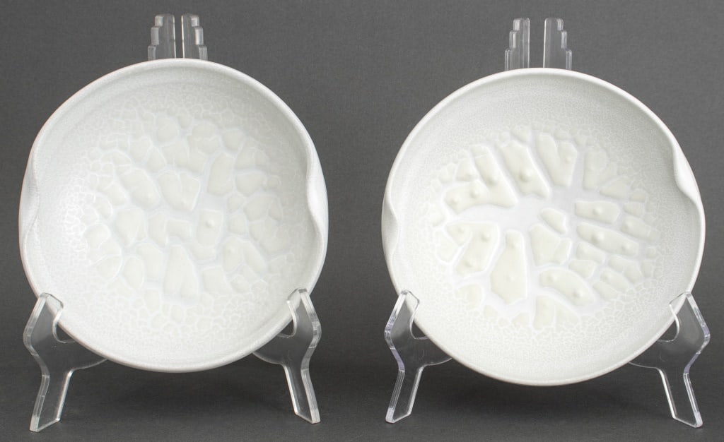 Thomas Bezanson Kairagi Glazed Porcelain Plates, 2: Pair of Brother Thomas Bezanson (Canadian, 1929-2007), Kairagi Glazed Porcelain Plates, with shaped rims, each marked with cobalt blue ichthys to underside. 2.25" H x 8" Diameter. Provenance: From 333